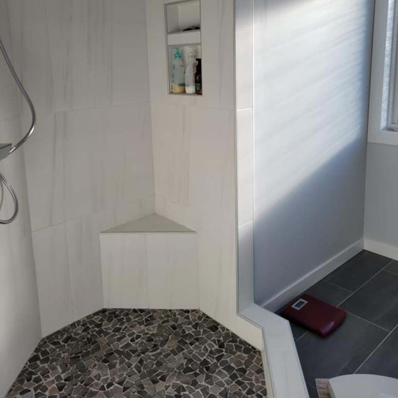 Renovated bathroom with tiled shower